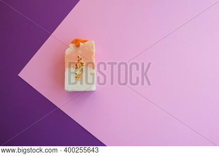 Flat Compplace For Your Text. Advertising Photo.osition With Natural Soap On Pink And Purple Backgro