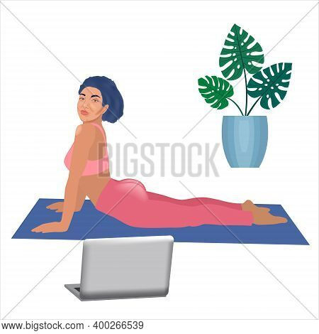 Beautiful Sporty Woman In Yoga Cobra Pose Doing Exersice Watching Video Online On Computor At Home D
