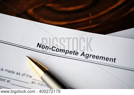 Legal Document Non-compete Agreement On Paper Close Up.