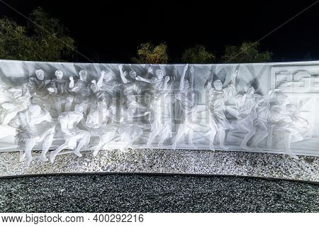 Fragment Of White Multi-figured Bas-relief Made Of Plastic Mesh By Artists Recycle Group. Art Compos