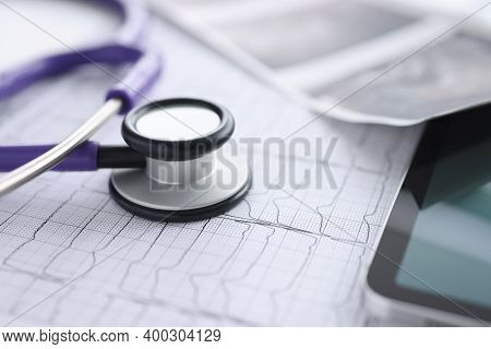 There Is Cardiogram Tablet And Stethoscope On Table. Examination Of The Cardiovascular System Concep