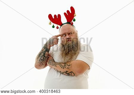 Isolated Portrait On A White Background Of An Overweigh Man With Tattooed Arms Wearing A Hoop With A