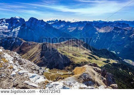 The Passo-Pordoi pass. Pordoi is a mountain pass of the Dolomites, located between the Sella mountain range and the Marmolada mountain. Warm sunny day in the Alps 