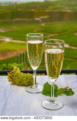 Tasting Of French Sparkling White Wine With Bubbles Champagne On Outdoor Terrace With View On Grand