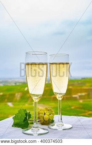 Tasting Of French Sparkling White Wine With Bubbles Champagne On Outdoor Terrace With View On Grand