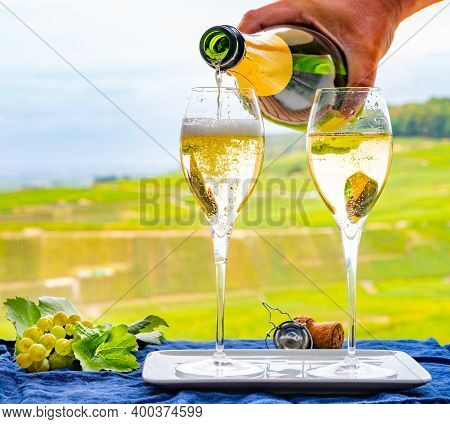 Tasting Of French Sparkling White Wine With Bubbles Champagne On Outdoor Terrace With View On Grand