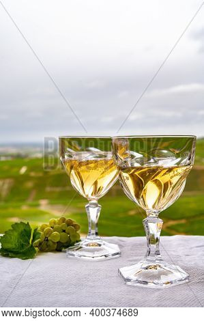 Tasting Of French Sparkling White Wine With Bubbles Champagne On Outdoor Terrace With View On Grand