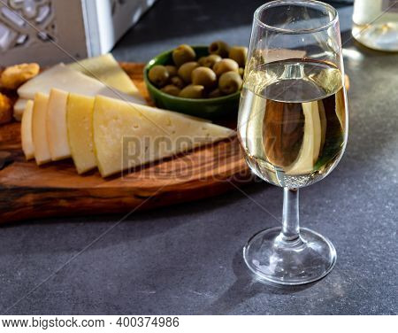 Tasting Of Fortified Andalusian Sherry Wine With Traditional Spanisch Tapas, Green Olives, Goat And