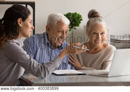 Female Consultant Have Meeting With Elderly Couple