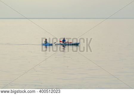 New Orleans, La - July 29, 2013: Two Men In Kayaks  Pause On Lake Pontchartrain On July 29, 2013 In 