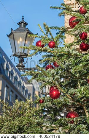 Berlin, Germany - December 18, 2020: Christmas Tree Decorated With Red Balls At The Street Behrenstr