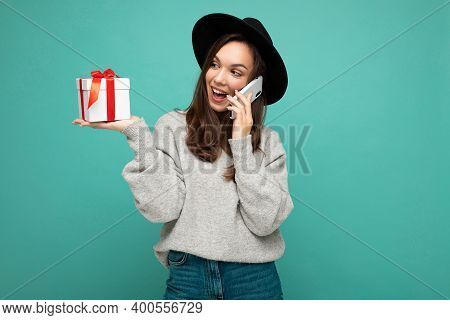Photo Of Beautiful Happy Positive Joyful Young Brunette Woman Isolated Over Blue Background Wall Wea