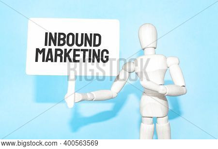The Wooden Man Holds A White Sign With The Text Inbound Marketing In His Hands. The Content Of The L