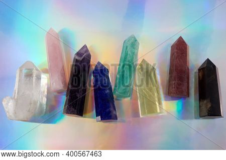 Healing Chakra Crystals On Halographic Background. Meditation, Reiki Or Spiritual Healing Background