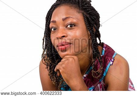 Closeup Of Pretty African Woman With The Fist Under Her Manton.