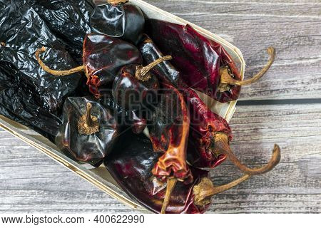 Close Up Of Various Dried Hot Chili Peppers.