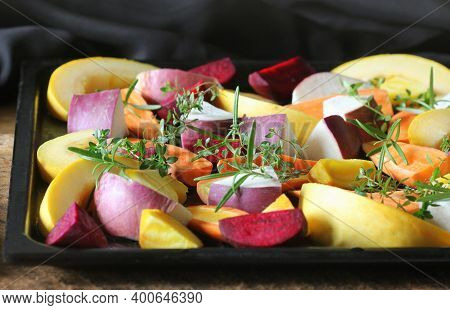 Pan Full Of Fall Seasonal Vegetables Ready To Be Grilled Over A Dark Background