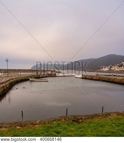 An Empty Marina In The Winter. Mountains In Fog In The Background. Picture From Molle, Scania County