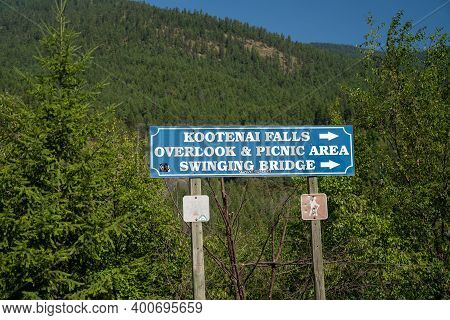 Libby, Montana - July 29, 2020: Sign For The Kootenai Falls Waterfall Overlook And Swinging Bridge