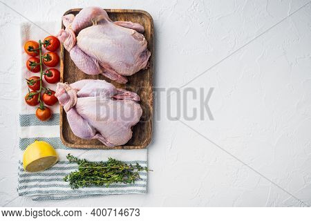 Raw Coquelet Chickens With Herbs And Ingredients, On White Background, Top View With Copy Space For 