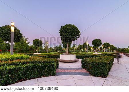 Maple Alley In French Garden In Public Landscape City Park Krasnodar Or Galitsky Park . Wooden Circu