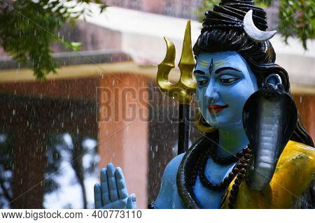 Statue Of Lord Shiva And Background Raining