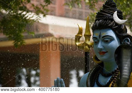 Statue Of Lord Shiva And Background Raining