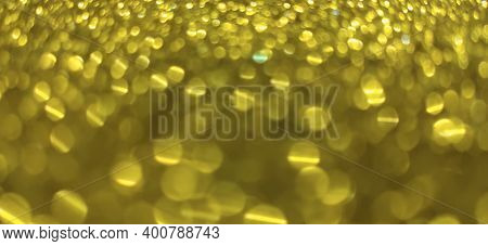 Closeup Of Golden Yellow Blurred Bokeh Abstract Backdrop