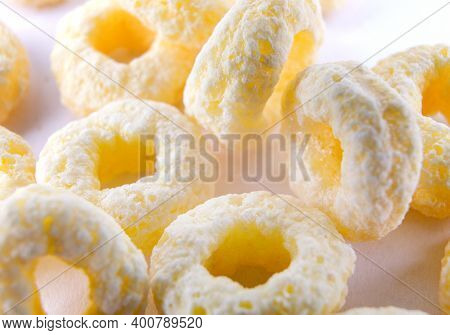 Corn Rings On A White Background. Corn Snack.