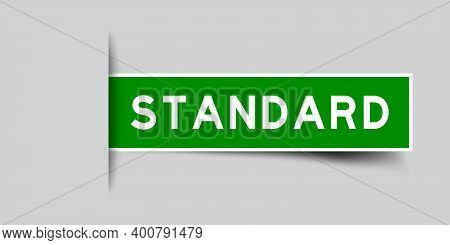 Inserted Green Color Sticker Label With Word Standard On Gray Background