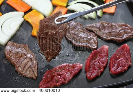 grilled meat by electric griddle, a rare part of japanese wagyu beef called Senbon