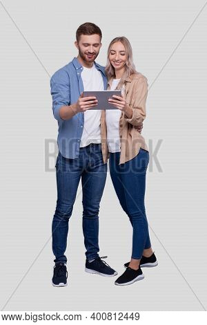 Couple Watching In Tablet Standing Isolated. Commecial, Shpping, Advertisment Concept