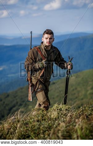 Hunter Man. Hunting Period. Male With A Gun. Close Up. Hunter With Hunting Gun And Hunting Form To H