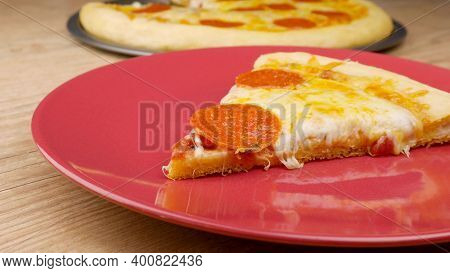 A Plate Of Food With A Slice Of Cake On A Table. High Quality Photo