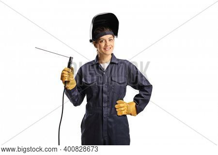 Young female welder in a uniform with a welding machine and a helmet isolated on white background                  