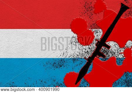 Luxembourg Flag And Black Rpg-7 Rocket-propelled Grenade Launcher In Red Blood. Concept For Terror A
