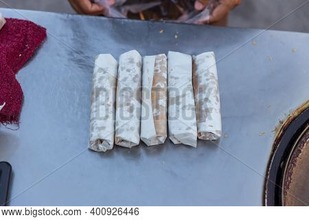 Roti Making, Roti Thresh Flour By Roti Maker With Oil. Indian Traditional Street Food. Thai Pancake 