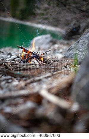 Safety Precautions: Campfire Near Stone In A Forest In Order To Avoid Forest Fire. Beautiful Bonfire