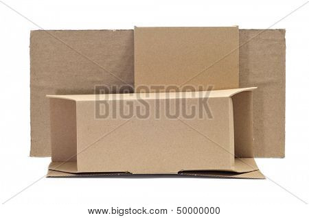 some brown cardboard boxes of different sizes and some pieces of corrugated cardboard on a white background