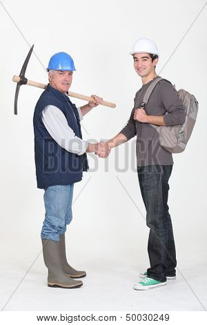 Experienced tradesman meeting his new apprentice for the first time