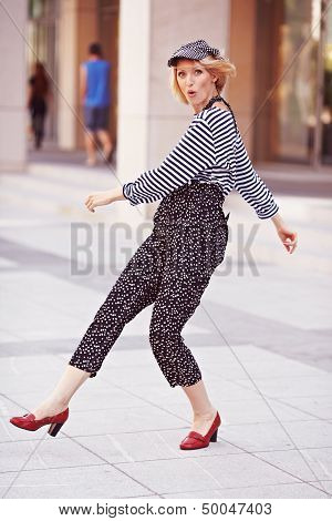 Beautiful girl in the striped vest