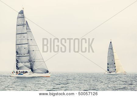 Sailing ship yachts with white sails