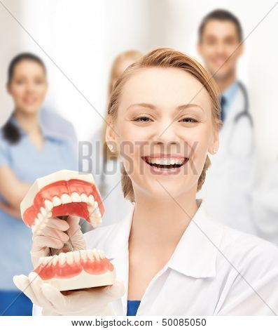 healthcare, medical and stomatology concept - attractive female doctor with big jaws