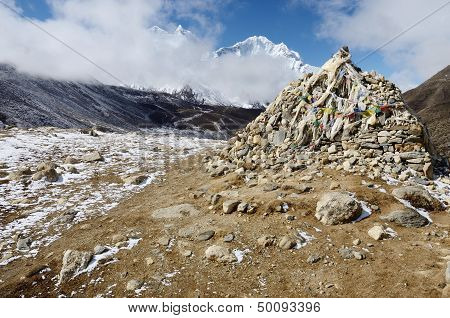 Stone Cairn With Religious Tibetan Flags Marks A Sacred Buddhist Place,Everest Region,Nepal