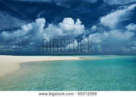 Beautiful island beach with sandspit at Maldives