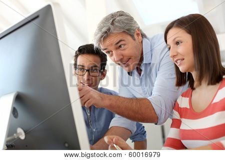 Teacher with group of students in class