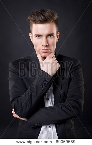 stylish young men in the studio isolated on black background