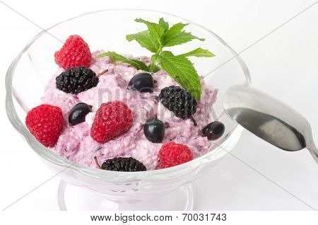 Tasty cream dessert with fresh berry on white plate