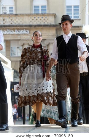 ZAGREB, CROATIA - JULY 19: Members of folk groups Nograd  from Salgotarjan, Hungary during the 48th International Folklore Festival in center of Zagreb, Croatia on July 19, 2014