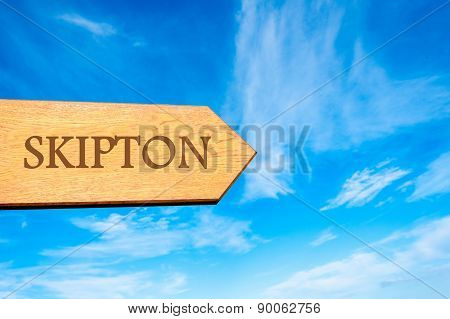 Wooden arrow sign pointing touristic destination